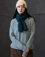 Écharpe tricotée à torsades en fil feutré