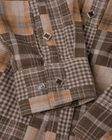 Patchwork Plaid Western Shirt in brown patchwork – close-up of pearl snap cuff