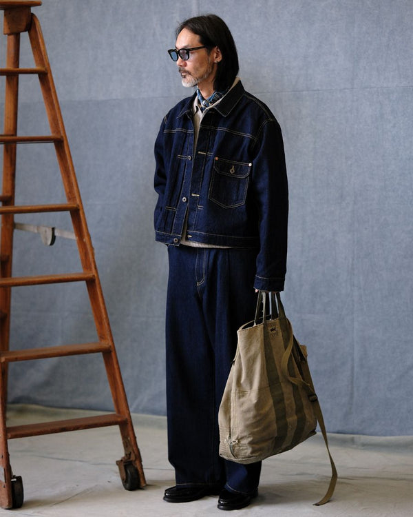 veste en jean trucker à épaules asymétriques