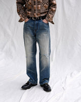 Distressed Redline Selvedge Jeans in vintage wash – front on model