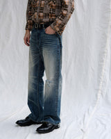 Distressed Redline Selvedge Jeans in vintage wash – side on model
