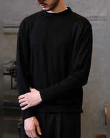 Fine Wool Mock Neck Sweater in black – worn by model, front