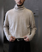 Fine Wool Turtleneck in oatmeal – worn by model, front
