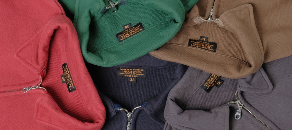 Five half-zip collared sweatshirts in red, green, brown, navy and charcoal grey
