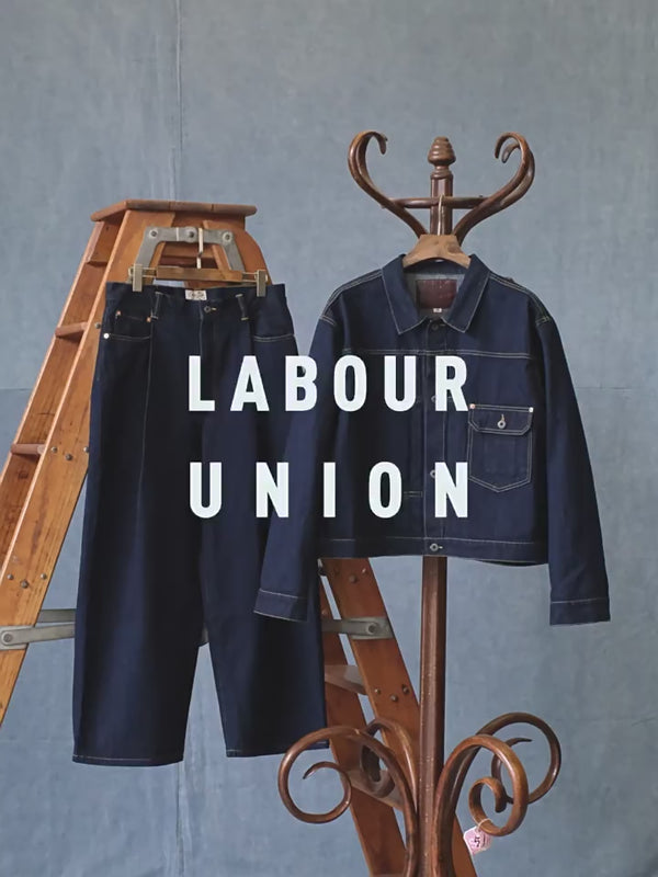 veste en jean trucker à épaules asymétriques