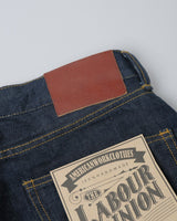 Red-line Selvedge 1950s High-waist Straight Jeans in raw indigo – close-up of leather patch