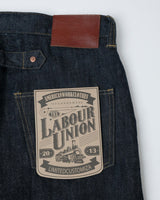 Blue-line Selvedge Straight Jeans in raw indigo – close-up of leather patch