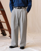 Washed Herringbone Pleated Trousers in light grey – front on model